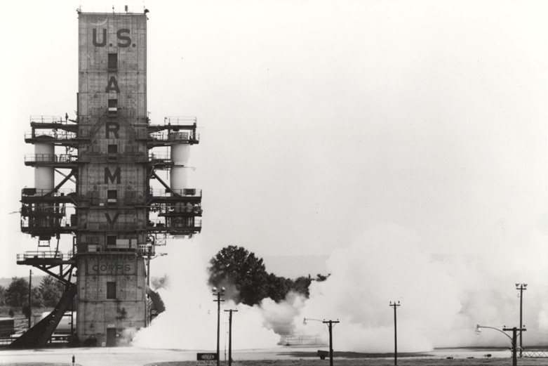 A black and white photo of a rocket launch pad that says U.S. Army.