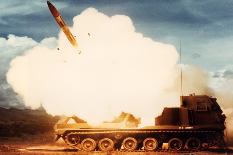 An older photograph of an army tank launching a missile